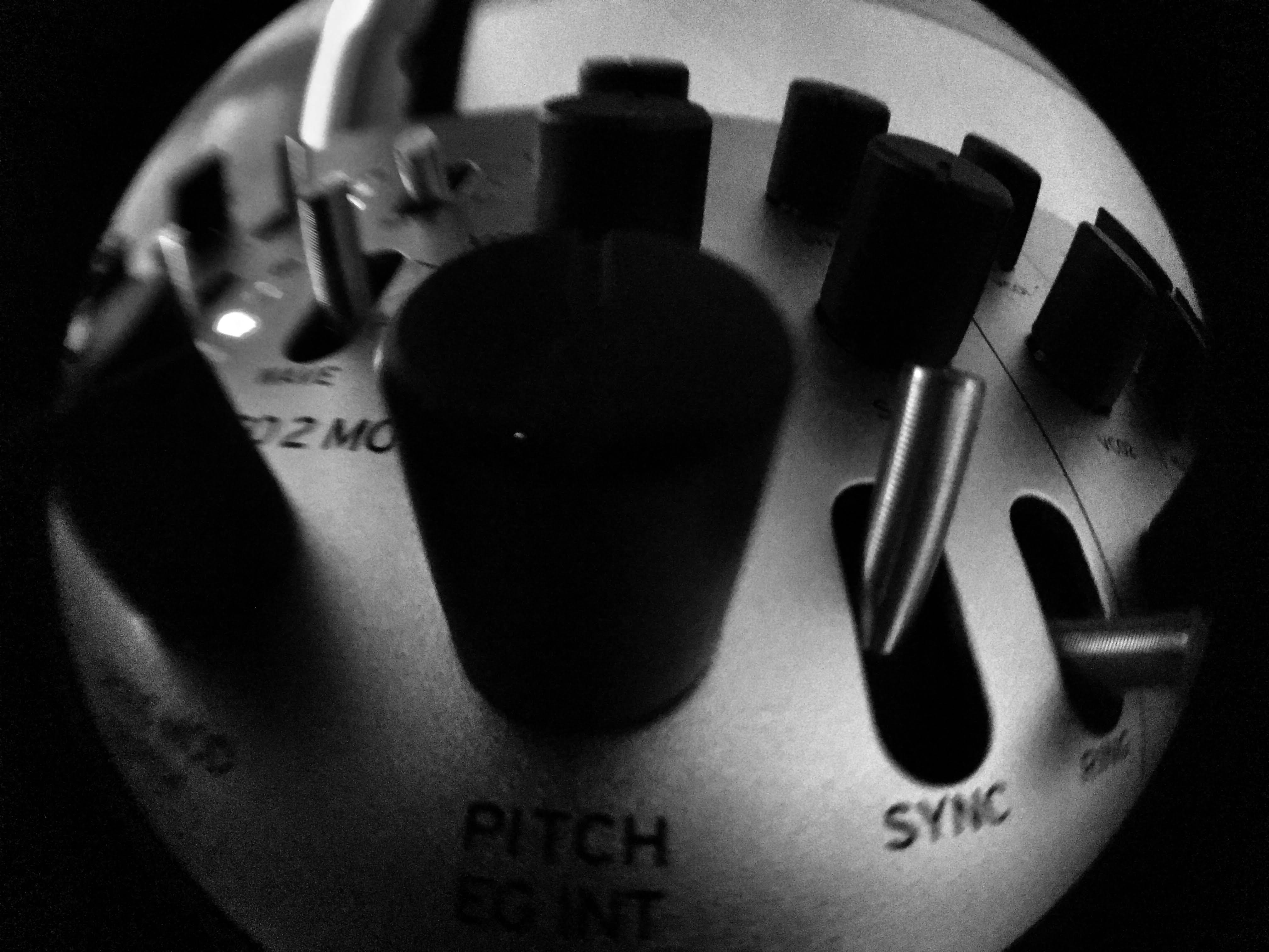Close-up of a turntable pitch and sync controls