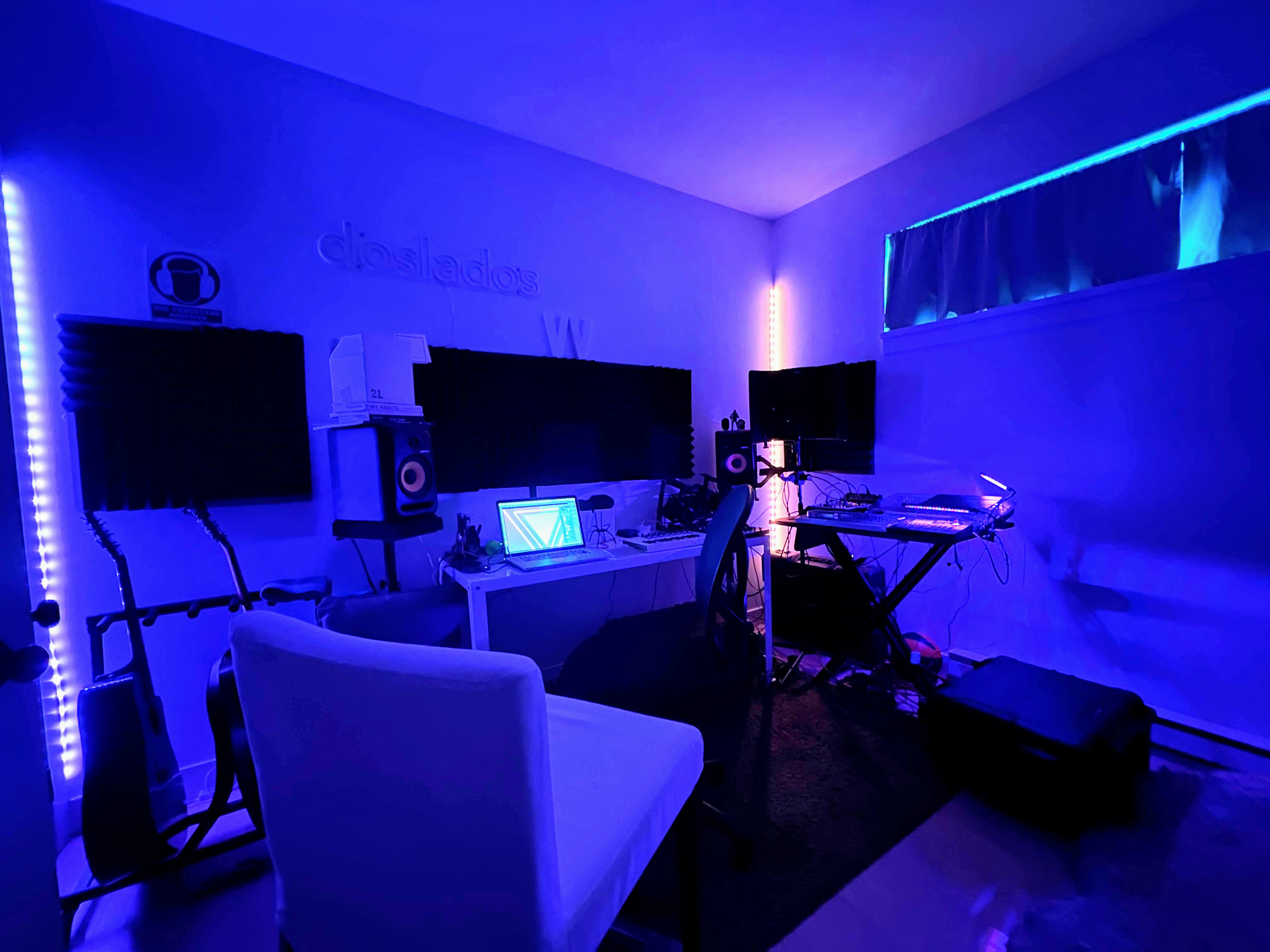 Home music studio with monitors and ambient lighting